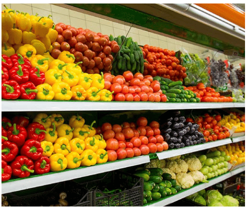 full supermarket shelves with vegetables